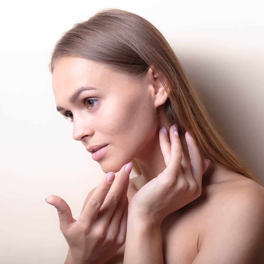 Young woman with slight acne